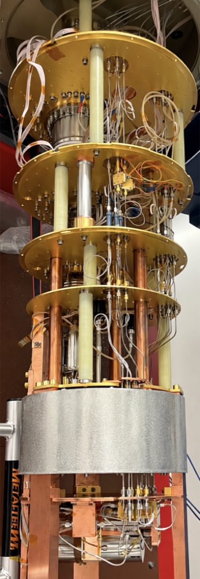 The NEXUS dilution refrigerator at Fermilab, showing its gold-plated cooling stages and copper shielding